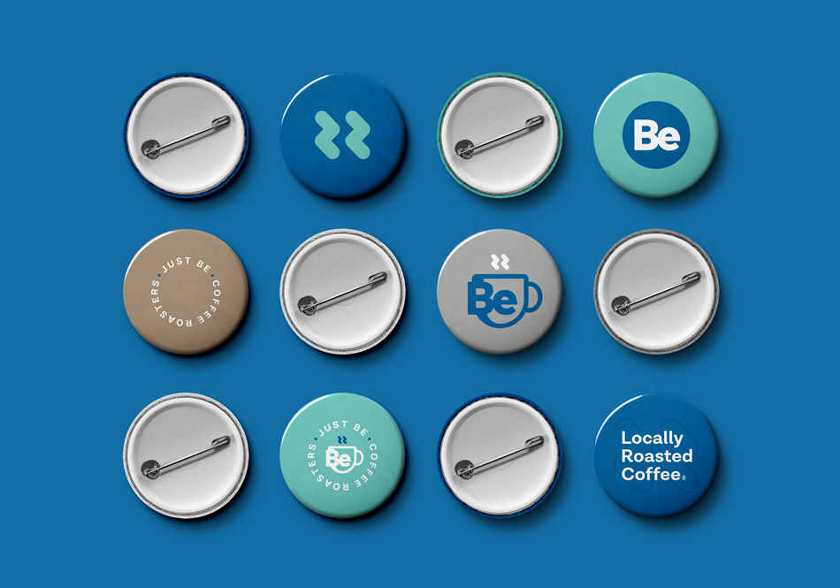 Various Just Be logo pins