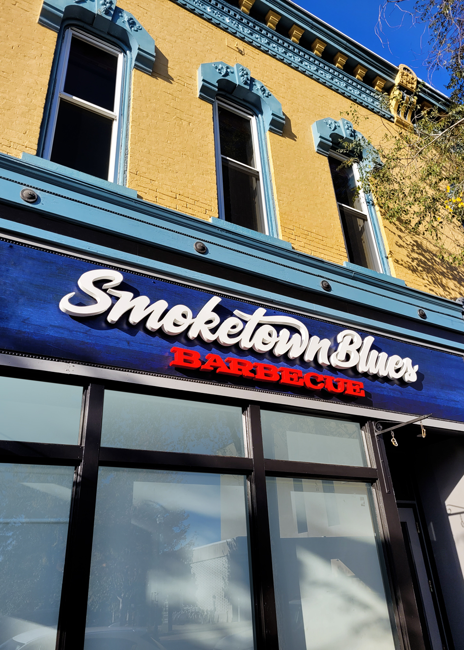 Smoketown Blues BBQ building sign logo at angle