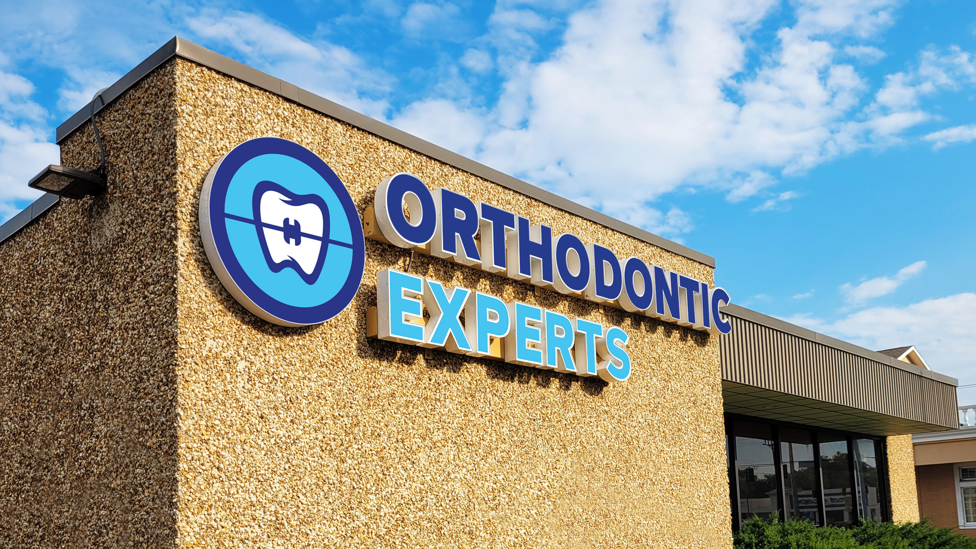 Orthodontic Experts logo design on the building sign
