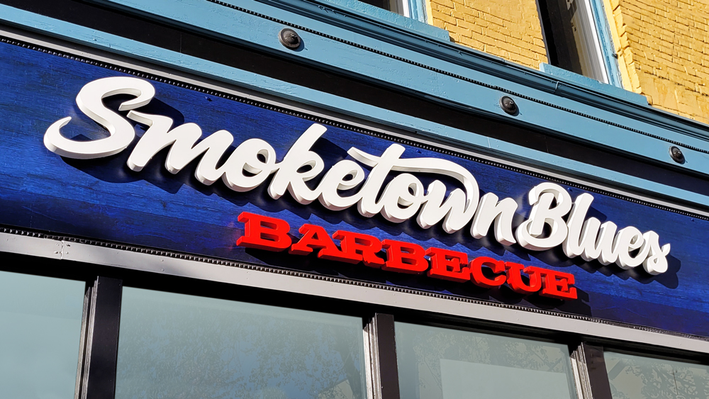 Smoketown Blues BBQ logo design on building facade