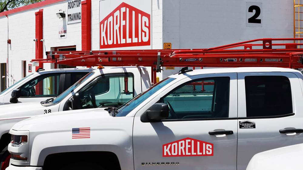 Korellis construction logo on fleet of work trucks